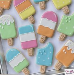 some colorful ice cream and popsicle cookies on a tray