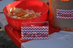 two red and white chevroned paper bags sitting on top of a table