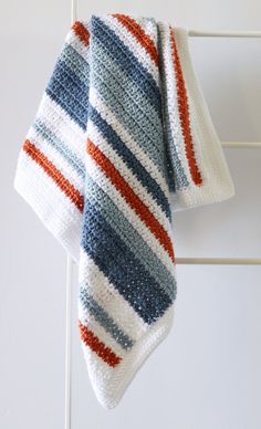 a crocheted dish cloth hanging on a towel rack