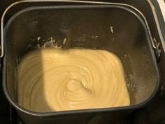 a pan filled with batter sitting on top of a stove