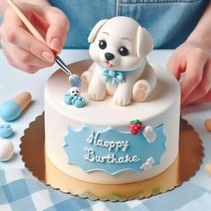 a person is decorating a birthday cake with a dog figurine