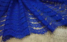 Chantilly Lace Width: 1.5 m / 59 inch listed for 1 yard Colors: royal blue Style: French The width of the lace, parallel to the edge, is 47 strips. Lace chantilly - a luxury that came from the past To create a beautiful wedding dress, you need not only a talent for designers and the ability to sew, but also beautiful quality fabrics. Chantilly lace is an excellent option, both for decoration and for making a completely wedding dress, because it is one of the most beautiful and popular types of l Blue Lace With Lace Trim For Wedding, Blue Lace With Patchwork For Party, Blue Lace Patchwork For Wedding, Blue Lace Patchwork For Party, Blue Lace For Wedding, Blue Lace Fabric, Black Lace Fabric, Sewing Wedding Dress, Royal Blue Lace