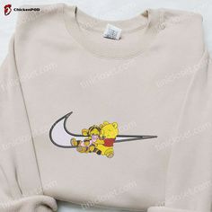 Introducing our Pooh and Tigger x Swoosh Cartoon Embroidered Shirt, a delightful blend of Disney magic and trendy style. This shirt features the beloved characters Pooh and Tigger, intricately embroidered onto a high-quality fabric that ensures comfort and durability. The playful design will surely bring a smile to your face, making it a perfect addition to your wardrobe or a thoughtful gift for any Disney fan. With its unique combination of iconic characters and modern fashion, this shirt offer