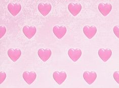 pink hearts are arranged on a light pink background