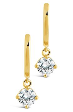 Faceted cubic zirconia drops draw the eye to huggie-hoop earrings finished in warm 14-karat-gold plating. 0.45" width; 0.75" drop Hinge with snap-post closure 14k-gold plate/cubic zirconia Imported Classic Dangle Huggie Earrings With Cubic Zirconia, Teardrop Prong-set Huggie Earrings, Classic Dangle Cubic Zirconia Huggie Earrings, Yellow Gold Teardrop Huggie Earrings, Nickel Free, Classic 14k Gold-filled Dangle Huggie Earrings, 14k Gold-filled Tarnish-resistant Drop Huggie Earrings, 14k Gold-filled Huggie Earrings With Dangling Charms, Earrings In Gold, Huggie Hoop Earrings