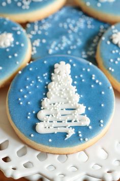 decorated cookies with frosting on a white plate