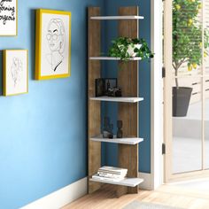 a room with blue walls and a book shelf next to a plant on the wall