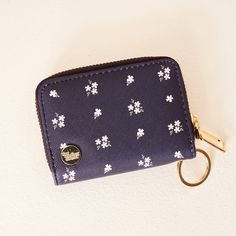 Unwrap a burst of floral fun this fall with our Pretty Posies Zip Around Wallet! Not only does it bloom with a delightful design, but it's also packed with practicality. With a handy keyring, 14 card slots inside, and even an exterior clear ID slot, this wallet keeps your essentials neat and tidy. Compact yet surprisingly spacious, it's the perfect companion for anyone who loves to keep things organized – and stylish! Treat yourself or gift it to someone special who adores a touch of floral flai Purple Games, Teacher Holiday Gifts, Gender Neutral Clothes, Wrist Wallet, Keychain Wallet, Sorority Gifts, Notebook Gifts, Coin Holder, Wristlet Keychain