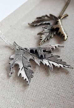 Statement Leaf Necklace, perfect for nature lovers in silver or bronze finish { D e s c r i p t i o n } The centerpiece of the necklace is a Canadian maple leaf pendant, which is known for its iconic and recognizable shape. The pendant is beautifully crafted with attention to detail, with every vein of the leaf captured.  The pendant is available in either a silver or bronze finish, allowing you to choose the color that best complements your personal style. The chain closes with a lobster clasp and is just the right length to sit comfortably against your chest. Great to wear over knits, thick blouses in autumn and winter. Also works amazingly with long bohemian dresses.  Whether you are looking for a piece of jewelry to wear for a special occasion, or you simply want to treat yourself to s Leaf Shaped Metal Jewelry For Gifts, Leaf-shaped Metal Jewelry For Gifts, Leaf-shaped Metal Jewelry As Gift, Nature-inspired Silver Brass Necklaces, Nature-inspired Silver Brass Necklace, Nature-inspired Silver Metal Necklace, Nature-inspired Silver Brass Jewelry, Boho Nature, Jewelry Rustic