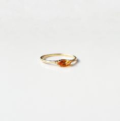 14k Gold Citrine Ring, 14k Gold Dainty Marquise Citrine Ring, 14k Gold Minimalist Citrine Ring, Stacking Citrine Ring Marquise Citrine Ring ✦ Product Features: ● Made to order ● Materials: Solid Gold ● Gold Kt: 9K, 14K, 18K  ● Gold color: Rose Gold, White Gold, and Yellow Gold ● Setting: Natural Citrine ● Total number of stones: 1 ● Total Citrine ctw: 0.20 ctw  ● Band width: 1.10mm ● Ready to ship: 7-10 business working days (excluding weekends) ✦ Gemstone Certificate: ● Absolutely, if you wish Faceted Topaz Ring In 14k Gold For Wedding, Faceted Topaz Ring In 14k Yellow Gold, Orange Topaz Promise Rings, Amber Topaz Birthstone Ring In Fine Jewelry Style, Orange Gemstone Promise Ring, Orange Topaz Gemstone Rings, Orange Citrine Birthstone Rings, Yellow Gold Faceted Topaz Promise Ring, 14k Gold Orange Jewelry With Prong Setting