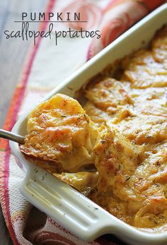 a casserole dish filled with potatoes and topped with a serving utensil