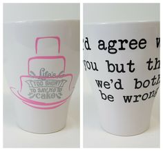 two coffee mugs with words written on the inside and outside, one is pink