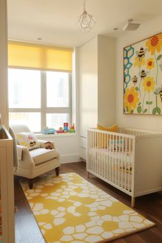 a baby's room with yellow and white decor