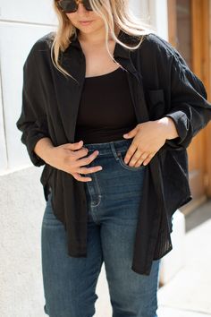 The Francine Button Down is the perfect top for all your wardrobe needs! Lightweight and roomy for tucking and layering, with a subtle gingham print to give you a bit of extra style — it's modest and relaxed, ready to become your go-to top this season! Winter Collection FIT Easy Roomy Fit Maternity/Nursing Friendly Functional Buttons Lightweight Ali is 5'5 Wearing Size Large X-SMALL SMALL MEDIUM LARGE X-LARGE XX-LARGE 30.5" Long 31" Long 31.5" Long 32" Long 32.5" Long 33" Long 25" Wide 26" Wide Versatile Button-up Tops For Layering, Oversized Button-down Tops For Layering, Oversized Buttoned Tops For Layering, Versatile Tops With Button Closure For Layering, Effortless Long Sleeve Black Tops, Chic Button-up Tops For Layering, Black Tops With Shirttail Hem For Daywear, Black Button-up Shirt For Layering, Effortless Layering Blouse For Fall