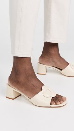 Larroude Flora Mules | Shopbop Leather Almond Toe Sandals For Work, Workwear Leather Sandals With Almond Toe, Workwear Almond Toe Leather Sandals, Cream Closed Toe Leather Mules, Cream Leather Mules With Leather Sole, Formal Beige Mules With Buckle Closure, Spring Round Toe Mules In Calf Leather, Classic Cream Sandals With Leather Sole, Cream Mules With Padded Heel And Round Toe