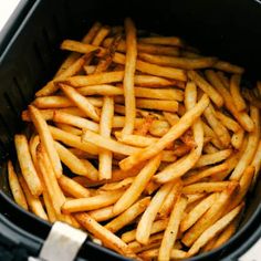 french fries are in an air fryer and ready to be cooked into the oven