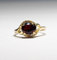 Gorgeous gold-plated faceted Garnet Crystal Ring-  January birthstone- with dazzling crystals.  size 9.75. It shines like real gold. GREAT Gift! No Tarnish It will come in a gift bag Gold Faceted Birthstone Ring For Anniversary, Gold Birthstone Ring With Cubic Zirconia, 14k Gold Faceted Birthstone Ring, Classic Gold Crystal Ring With Birthstone, Gold Faceted Round Cut Ring, Gold Faceted Birthstone Ring For Wedding, Gold Crystal Birthstone Ring For Promise, Gold Rings With Birthstone For Jewelry Making, Classic Gold Crystal Ring With Accent Stones