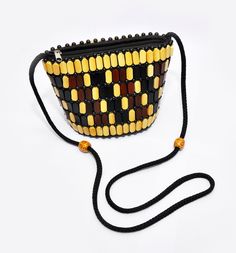 African gift stylish handmade hand bag/ Kenya beaded hand made maasai small hand bag Wooden woven and beaded handmade bag Lining is polysterene Leather bag round base small stylish handbag Size -  Width 7 1/2 by 6 Height by 4 Depth (aprx) Traditional Black Rectangular Shoulder Bag, Yellow Rectangular Bucket Bag As Gift, Multicolor Beaded Handheld Shoulder Bag, Yellow Beaded Rectangular Bag, Traditional Handmade Yellow Shoulder Bag, Handmade Black Rectangular Bucket Bag, Handmade Rectangular Black Bucket Bag, Traditional Handheld Beaded Shoulder Bag, Traditional Beaded Handheld Shoulder Bag