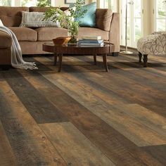 a living room with wood flooring and furniture