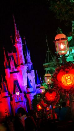 the castle is lit up at night for halloween