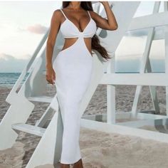 White Cut Out Dress Purchased From A Boutique. Never Worn, No Tags. Size Large Can Fit A Small Or A Medium. White Fitted Bodycon Dress For Vacation, White Bodycon Dress For Vacation In Spring, White Bodycon Dress For Spring Vacation, White Cutout Maxi Dress For Vacation, White V-neck Bodycon Dress For The Beach, White V-neck Bodycon Dress For Beach, Chic White Bodycon Dress For Vacation, White Cutout Beach Dress, Elegant White Bodycon Dress With Cutout