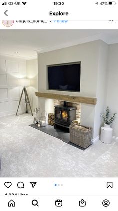 an image of a living room setting with fireplace and flat screen tv on the wall