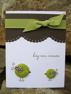 a card with two green birds on it