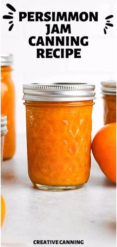 jars filled with orange jam sitting on top of a white counter next to oranges