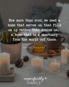 candles on a table with an inspirational quote