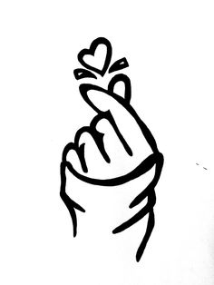 a black and white drawing of a hand holding a heart on it's finger