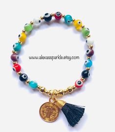 This beautifully handmade bracelet is made of round medium sized (6mm) glass eye beads that are multicolors. They are made with elastic string and stretch to fit most wrists. These are a great accessory for any occasion. This bracelet is great for spiritual and evil eye purposes. In many cultures it is is believed that when a person wears or carries an evil eye with them, it guards against misfortune happening in one's life. The evil eye is believed to bring good luck and protect from any ill-wi Adjustable Evil Eye Bracelet With 8mm Beads, Spiritual Multicolor Round Stretch Bracelet, Adjustable Multicolor Evil Eye Beads, Adjustable Multicolor Rosary Bracelet With Round Beads, Spiritual Multicolor Beaded Bracelets With Evil Eye, Multicolor Evil Eye Bracelet Gift, Adjustable Evil Eye Bracelet With Colorful Beads, Multicolor Evil Eye Bracelet With Round Beads, Adjustable Multicolor Evil Eye Bracelet With 8mm Beads