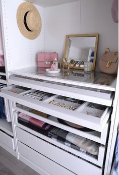 an organized closet with drawers and shelves filled with personal items, such as purses