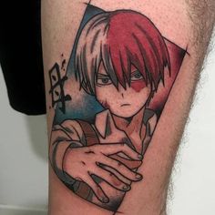 a man's leg with a tattoo on it that has an anime character holding his arm