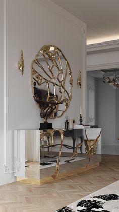 a large mirror sitting on top of a wooden floor next to a white table and chair