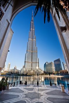 the tallest building in the world, burj dubai is seen through an arch