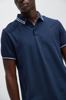 Model Height: 6'2 - Wearing Large Big & Tall: Height 6'3- Wearing XXXL Available In Black, White, Grey, Pink, Red, Navy, Neon Pink, Neon Yellow, Green, Yellow, Light Blue, and Coral Fold Down Collar 3 Button Closure Short Sleeve 100% Cotton Imported | Mens Wilson Short Sleeve Polo in Navy Blue size Small by Fashion Nova Navy Fitted Collared Tops, Fitted Navy Collared Tops, Fitted Collared Navy Tops, Navy Fitted Tops With Collared Neckline, Navy Fitted Top With Collared Neckline, Sporty Blue Tops With Collared Neckline, Navy Collared Cotton Tops, Blue Sporty Top With Collared Neckline, Sporty Blue Top With Collared Neckline