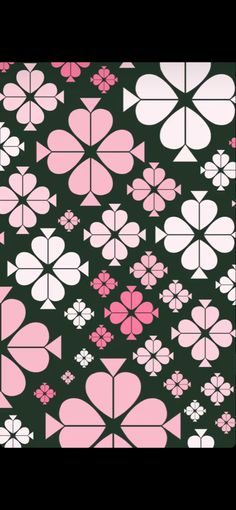 a black background with pink and white flowers in the shape of heart shaped shapes on it