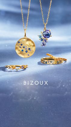 three different types of jewelry on a blue background