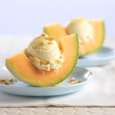 two pieces of melon with ice cream on them