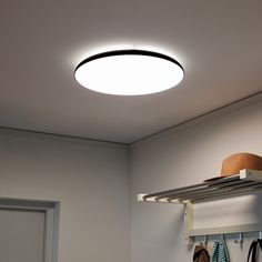 a ceiling light that is on top of a shelf