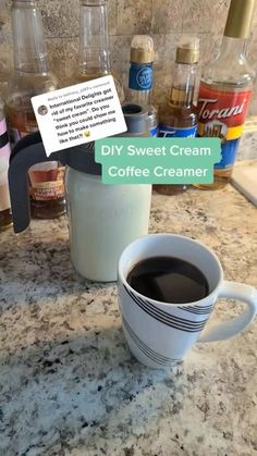 a cup of coffee sitting on top of a counter