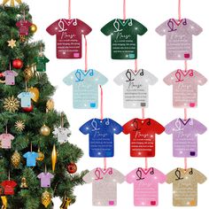 a christmas tree decorated with t - shirts hanging from it's sides and ornaments