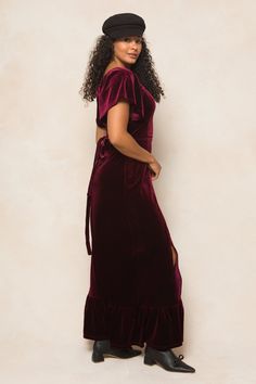 Dress to impress in our Maddie Dress. This stunning maxi-length dress features a wine velvet fabric and a square neckline with short flutter sleeves. The lace-up corset detailing on the back adds a touch of sass, while the hidden back zipper ensures a seamless silhouette. With a lined bodice and stretch fabric, this women's dress combines comfort and style. Elegant Short Sleeve Velvet Dress, Fitted Maxi Dress With Flutter Sleeve For Date Night, Fitted Flutter Sleeve Maxi Dress For Date Night, Short Sleeve Velvet Party Dress, Velvet Short Sleeve Party Dress, Flutter Sleeve Maxi Dress For Gala, Fitted Maxi Dress With Flutter Sleeve For Gala, Fitted Dress With Tie Back And Flutter Sleeves, Fitted Burgundy Maxi Dress With Short Sleeves