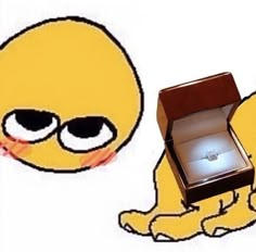 an open box with a ring in it sitting next to a cartoon character's face