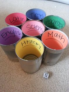 a pile of tin cans with words written on them