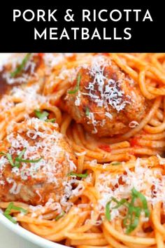 spaghetti with meatballs and parmesan cheese in a white bowl