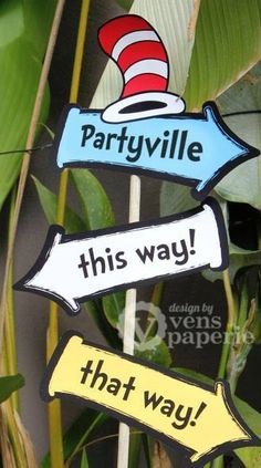 three signs that say partyvillee, this way and that way