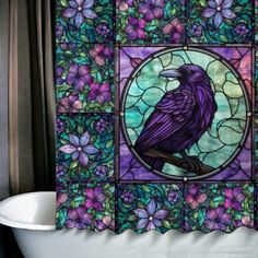 a bath tub sitting under a stained glass window