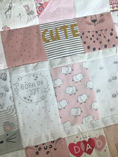 a quilt made to look like baby clothes