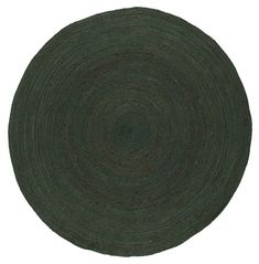 a round rug made from dark green wool